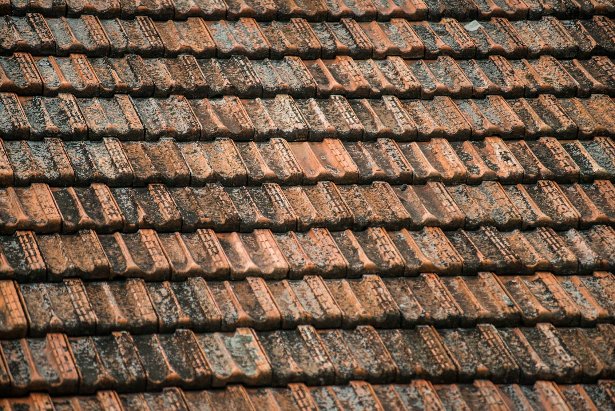 texture of old weathered red roof tiles